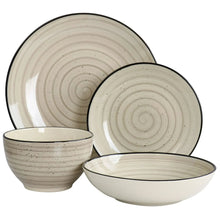 Stoneware dinnerware set in cream: stacked plates and bowls with black rim details