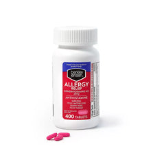 Berkley Jensen allergy relief tablets bottle with pink tablets spilled in front