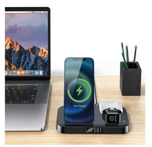 Charging alarm clock station with phone cradle, smartwatch stand, and charging slots