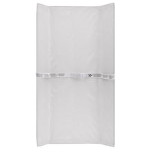 White changing pad cover, folded flat with securing strap across middle