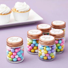 Mini mason jar shot glasses with copper lids, clear jars filled with colorful candies