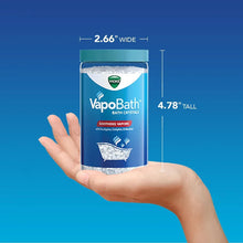Vicks VapoBath bath crystals jar held in hand with 2.66" wide and 4.78" tall labels
