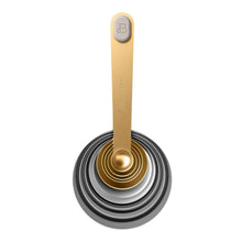 Gold measuring spoon tool with circular ring base from the mix & measure set