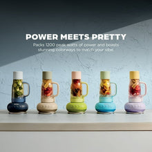 Personal blenders in multiple colors on a shelf, each with clear jar and base.