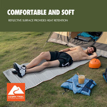 Light gray PE sleeping pad with raised bump texture, shown on the ground