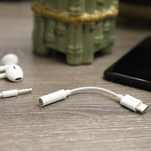 White USB-C to 3.5 mm adapter cable with USB-C plug and 3.5 mm jack