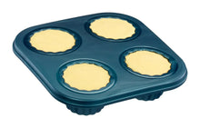 Blue six-cup muffin tray with four filled molds for pretend baking