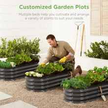 Charcoal oval raised metal garden bed planter with leafy greens and a gardener tending plants