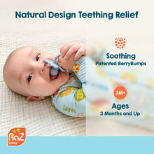 RaZberry silicone teether toy in baby hands, blue textured berry teether.
