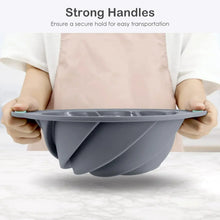 Silicone bundt cake pan with side handles, dark gray