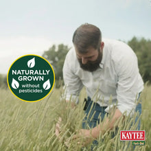 All Natural Timothy Hay showing a farmer kneeling in tall grass with a naturally grown badge