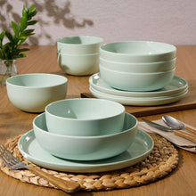 Green melamine dinnerware set, stacked bowls and plates