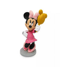 Minnie Mouse figurine standing on round base, pink dress and white gloves