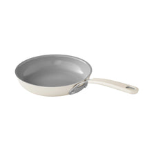 Beige nonstick skillet with gray interior and white handle