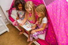 Pink arched bed tent with star pattern, children sitting inside and reading books