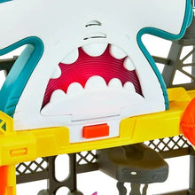 Shark-themed station panel with red teeth detail and teal slide supports