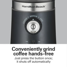 Black electric coffee grinder with top control knob and grind setting dial