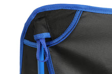Blue drawcord detail on black mesh camping chair seat and back.