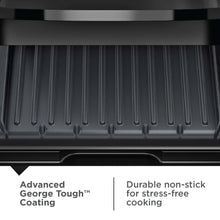Close-up of black ridged nonstick cooking plates on a grill maker