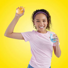 Child holding a blue water balloon, with other balloons in hand