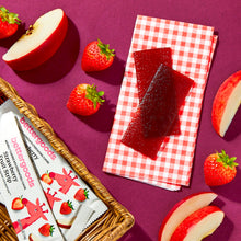 Strawberry fruit strips in foil wrappers with visible strip pieces