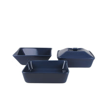 Dark blue square stoneware dinnerware set with rectangular serving dishes and bowls