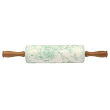 Ceramic rolling pin with green floral barrel and wood handles