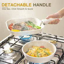 Cream white frying pan with detachable handle on a gas stove