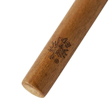 Wooden-handled utensil with engraved snowflake design