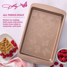 Rectangular cake pan with embossed butterfly pattern on base, rose-gold non-stick finish.