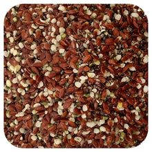 Chia, hemp, and flax seed mix, speckled dark and light seeds in a pile