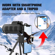 Black monocular with smartphone adapter mounted on tripod, green lens