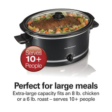 Black slow cooker with glass lid and food inside; round control knob on front