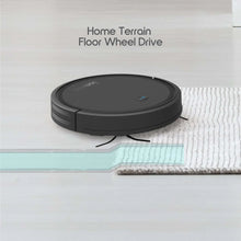 Black robot vacuum cleaner on light carpet with floor wheel drive motion indicator