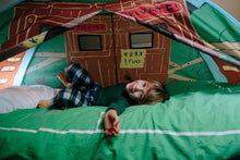Tree house pop-up bed tent interior, blue and green walls with illustrated house front