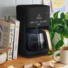 Black 14-cup drip coffee maker with glass carafe and gold-tone handle.