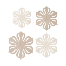 Beige flower-shaped ceramic coasters or trivets, set of four