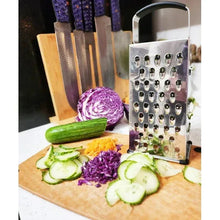 Stainless steel box grater with black handle and multiple grating holes
