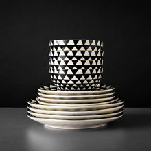 Black-and-white ceramic bowl and plate stack with triangle medallion pattern