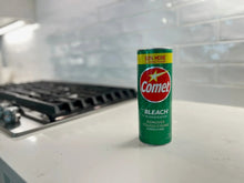 Comet bleach cleaning powder can, green with Bleach and stain-removing text