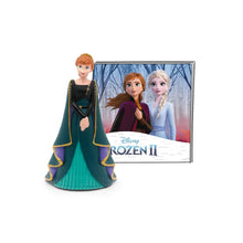 Elsa princess audio figurine with teal gown and dark cape beside Frozen II card