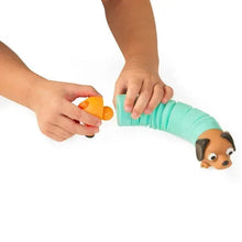 Toddler hands stretch and twist an aqua sensory tube with a dog-shaped end