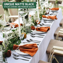 Matte black flatware at a table setting with plated place cards
