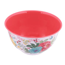 Red melamine mixing bowl with colorful floral exterior and glossy finish