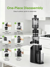 Black slow masticating juicer with removable parts shown beside it on a kitchen counter.