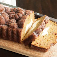 Sliced bundt loaf with browned crumb and golden interior