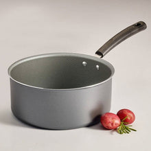 Tramontina non-stick saucepan with dark interior texture and side handle
