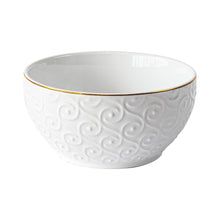 White stoneware bowl with embossed swirls and gold-trimmed rim