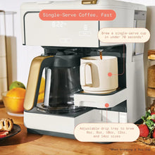 White coffee maker showing carafe on left and single-serve cup on right