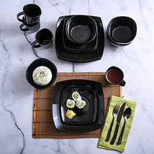 Black square dinnerware set with square plates, bowls, and mugs in top view
